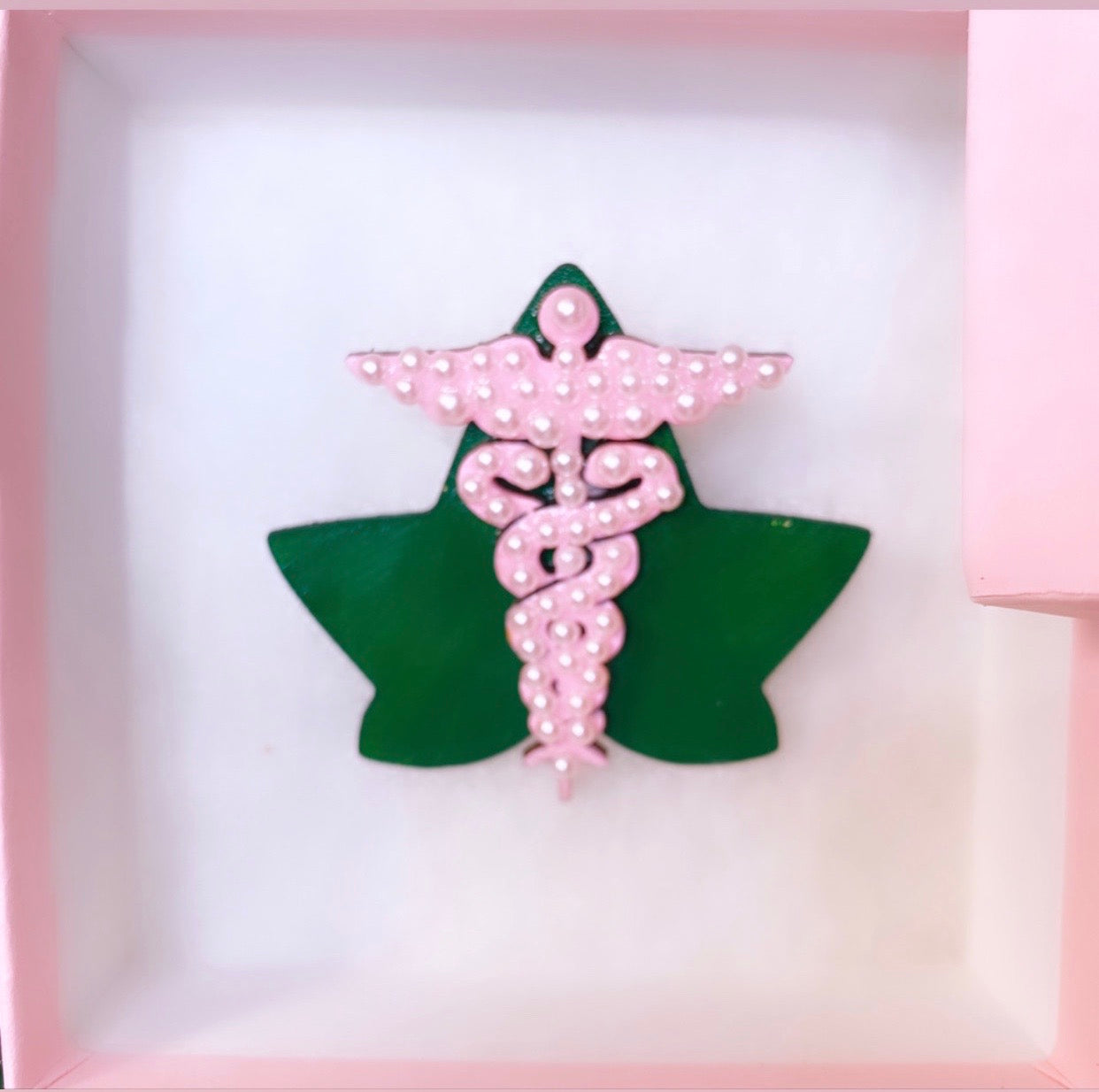 Pink, pearl, and green ivy AKA Caduceus medical brooch for  healthcare professionals.