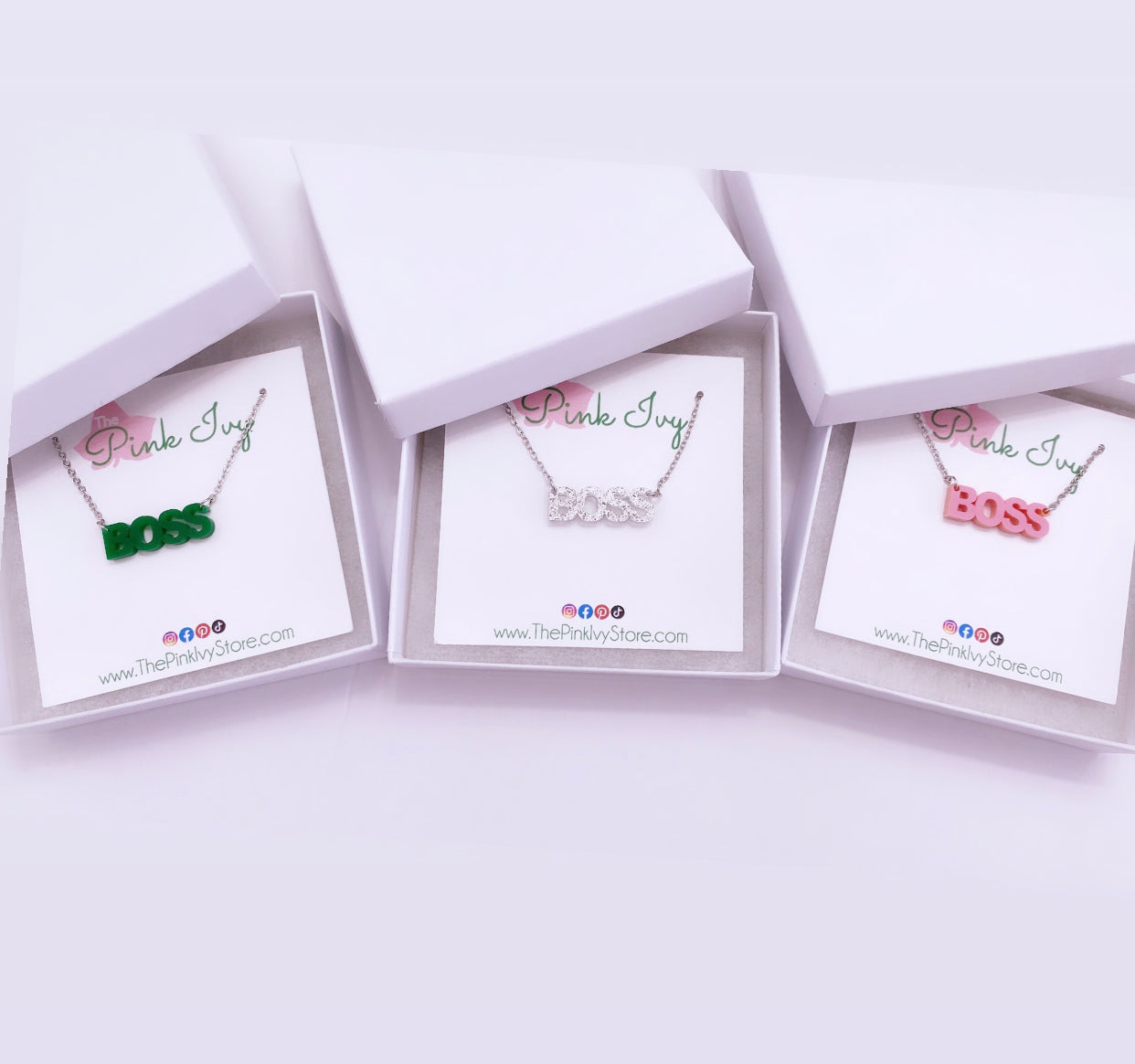 Boss necklaces available in white silver, pink, and green.