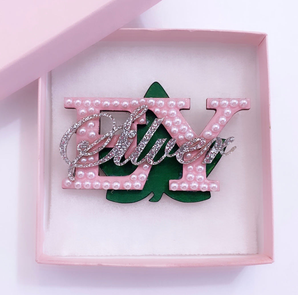 Personalized Silver Start brooch with pink chapter symbols and leather green ivy leaf.
